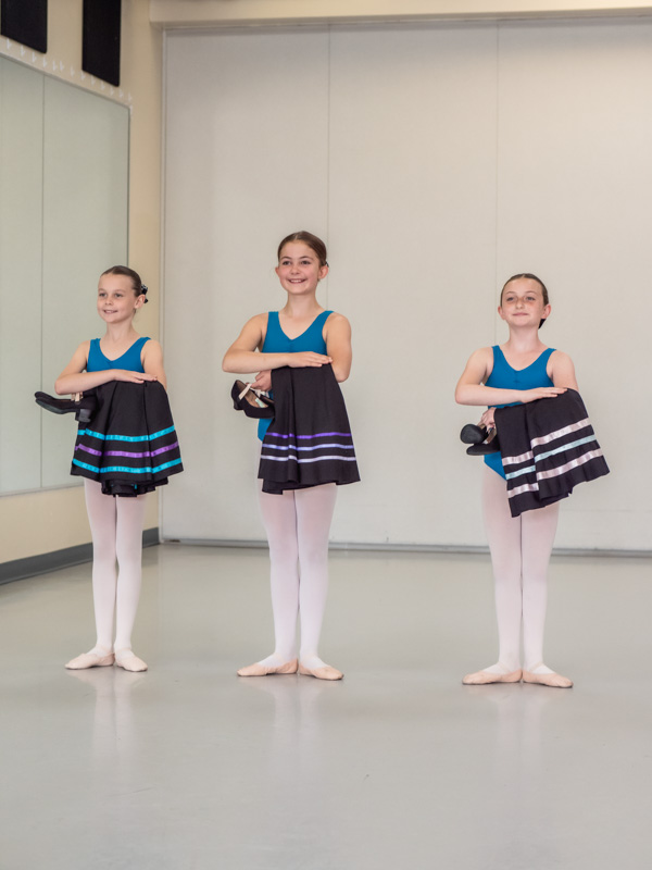 Greta Leeming Studio of Dance - Ottawa Dance Studio - Recreational Competitive Adult Toddler - 30 rad ballet dancers running into exam room with their character skirts